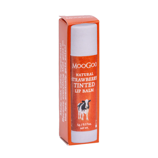 MooGoo Strawberry Tinted Lip Balm in box on plain white background, natural lip care with edible oils, soft hydration and a gentle strawberry flavour, phthalate free, petroleum free, beetle and synthetic dye free. 