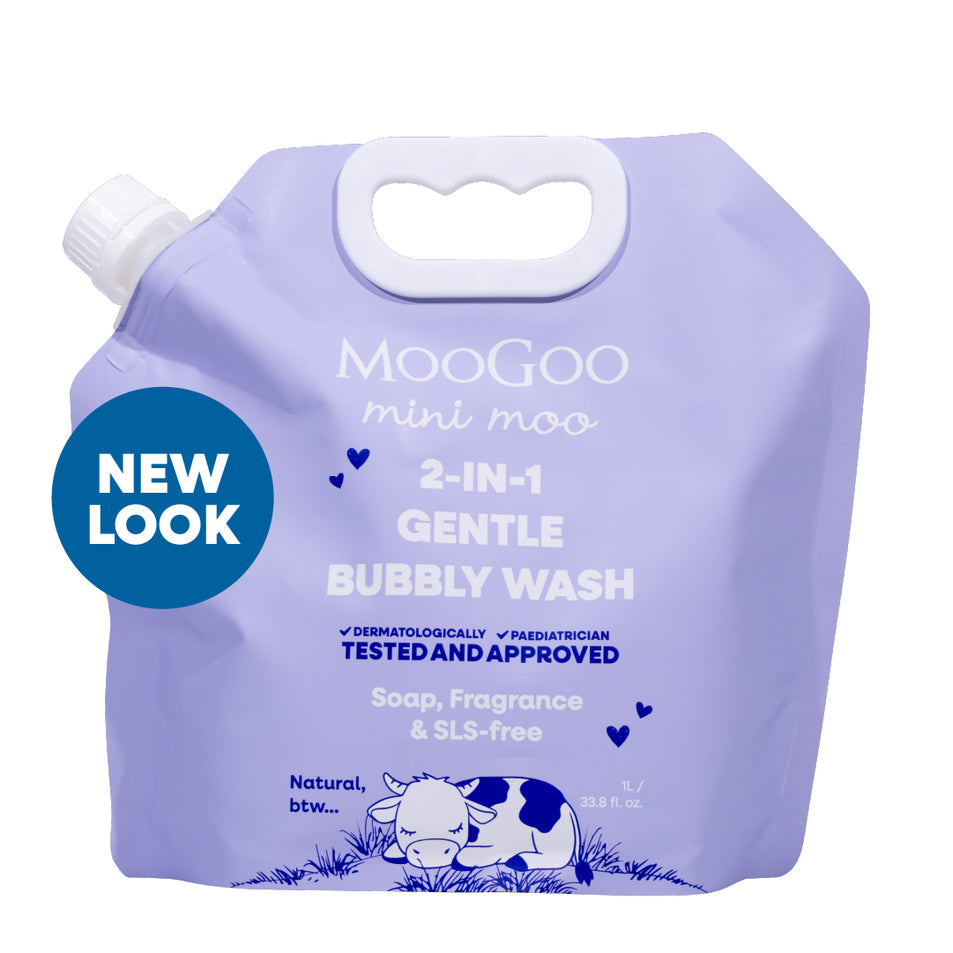 Purple packaging of MooGoo baby and child mini moo 2-in-1 Gentle Bubbly Wash with a cow illustration on a white background. Paediatrician approved gentle cleaner & bubble bath. Soap & SLS free. 