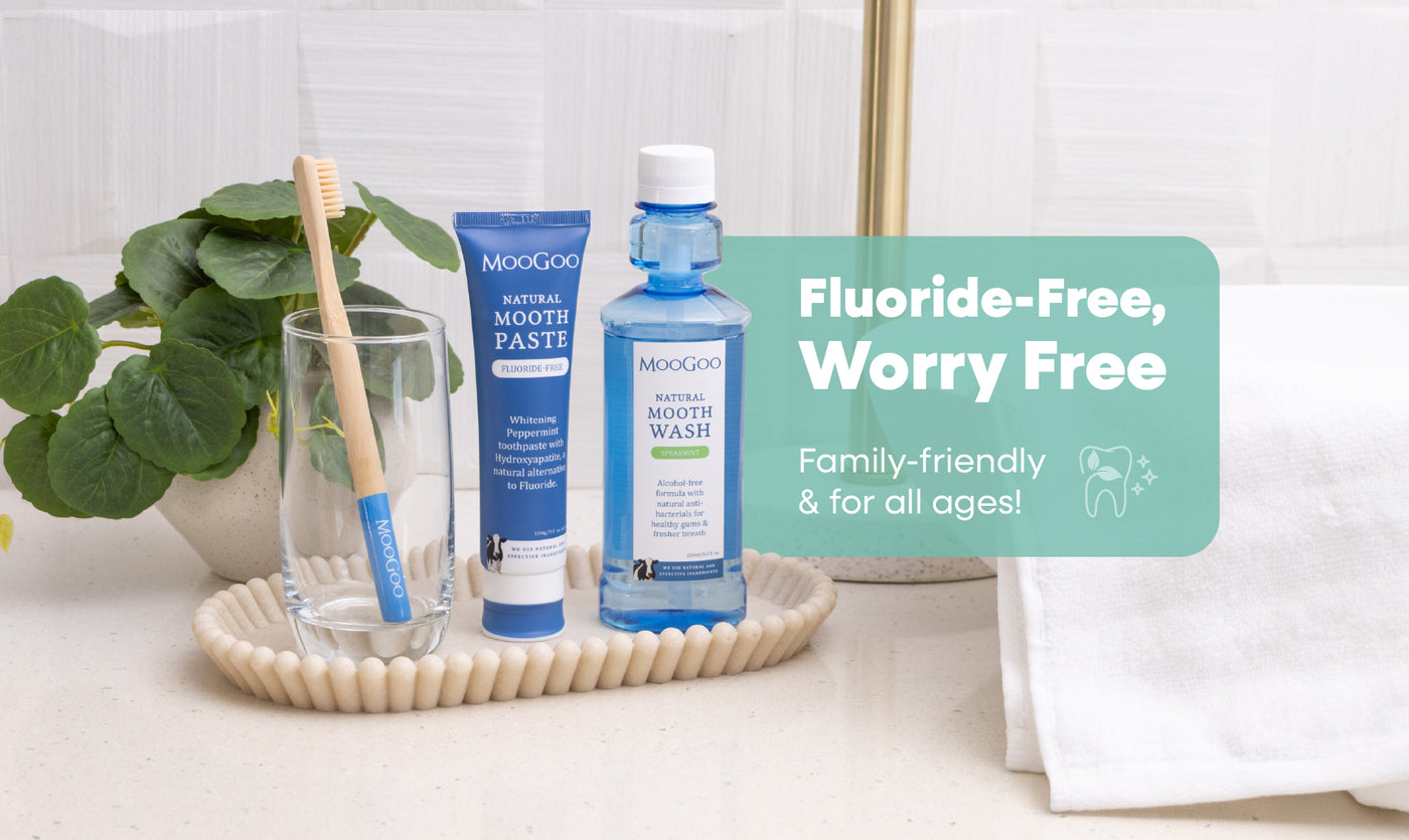 MooGoo mouthwash, toothpaste, and toothbrush on a bathroom counter. Fluoride-Free, Worry Free. Family-friendly and for all ages. 