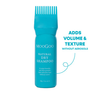 A turquoise blue bottle of MooGoo Natural Dry Shampoo with a matching wide-tooth comb applicator on top, shown on a white background. Increase Volume and texture while refreshing hair with no aerosols. 