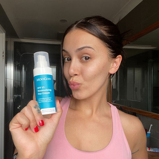 MooGoo SPF 15 Moisturising Day Cream in hand, natural daily cream with clear zinc and raspberry seed oil for sun protection and anti-ageing support.