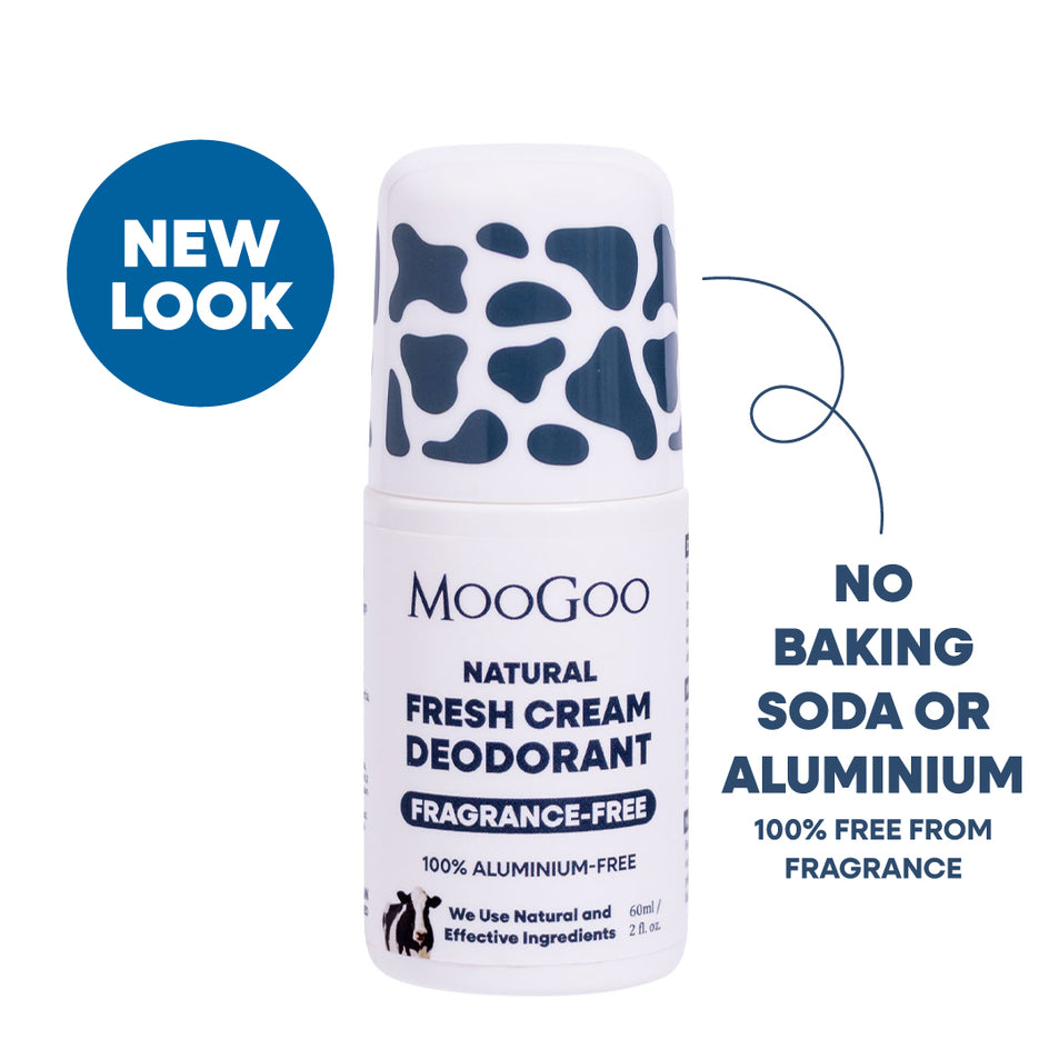 MooGoo Natural Fresh Cream Deodorant roll-on bottle with a white body and dark blue cow-print cap, shown on a white background with blue promotional text and a blue 'NEW LOOK' badge. No baking soda or aluminium. 100% free from fragrance. 