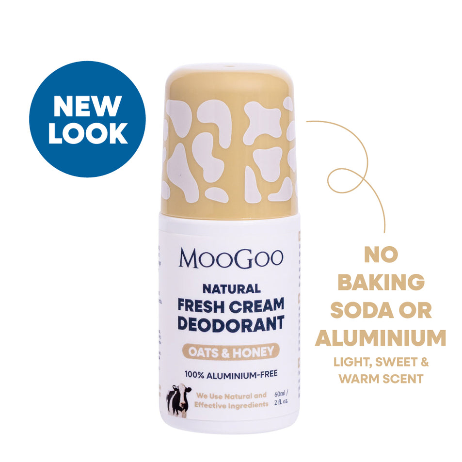 MooGoo Natural Fresh Cream Oats & Honey deodorant roll-on bottle with a beige and white cow-print cap, shown on a white background with a blue 'NEW LOOK' badge. Aluminium and baking soda free natural roll-on with gentle alkaline formula to prevent odour. 