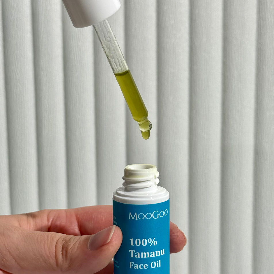MooGoo Tamanu Face Oil being dispensed into bottle, reduces scars, stretch marks and blemishes.
