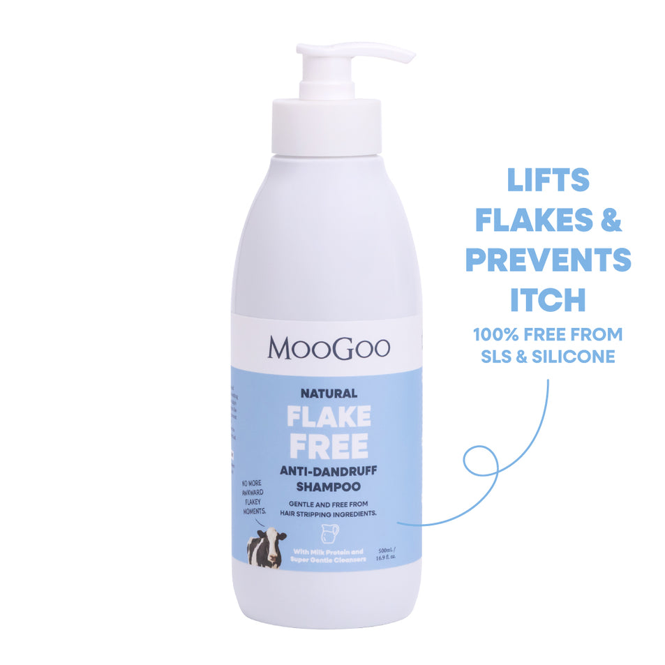 MooGoo Natural Flake Free Anti-Dandruff Shampoo in a white pump bottle with a blue label, shown on a white background with promotional text on the right. Gentle SLS-free cleanser to fight dandruff and soothe itchy, flaky scalp. 