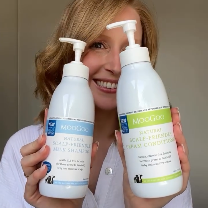 MooGoo Natural Sensitive Scalp Milk Shampoo shown with smiling woman, gentle sulphate-free hair care