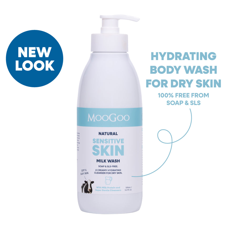 A bottle of MooGoo Natural Sensitive Skin Milk Wash with a pump dispenser, shown on a white background with promotional text and a blue 'NEW LOOK' badge. Hydrating face and body wash with phthalate free fragrance for sensitive skin. 