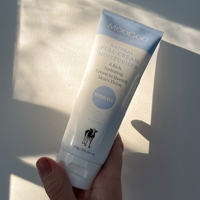 MooGoo Full Cream moisturiser shown in natural light, nourishing full cream with milk protein and honey