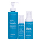 MooGoo Face Hydration Essentials Pack containing three blue MooGoo skincare bottles on a white background: a large face cleanser pump bottle, a smaller serum bottle, and a hydrating face cream pump bottle. Natural skincare products designed to rehydrate, nourish and restore skin moisture barrier. 