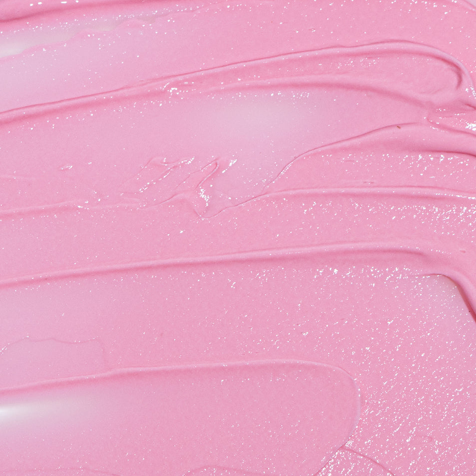 Pink butter-y smooth cream texture with smears and streaks - MooGoo Pink Eczema Cream.