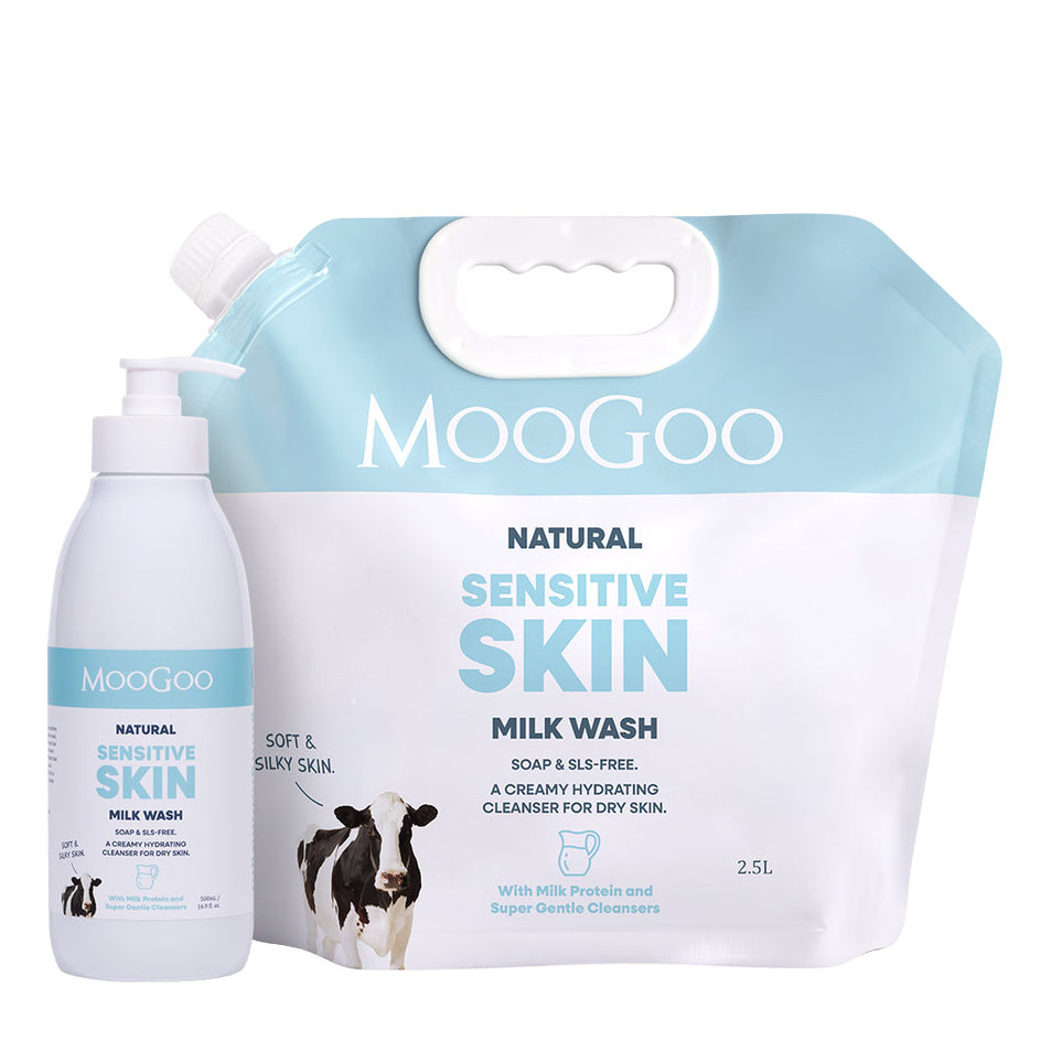 MooGoo Natural Sensitive Skin Milk Wash set, featuring a 2.5L refill pouch and a 500ml pump bottle, both in white and light blue packaging with a cow graphic. 2.5L bulk refill set, low-irritant cleanser for face and body, paraben and SLS free. 