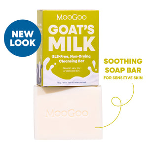 MooGoo Goat's Milk Soothing Cleansing Bar shown with its yellow-green packaging box and the bar itself on a white background. SLS free soothing soap bar for sensitive skin to calm and hydrate delicate or irritated skin.