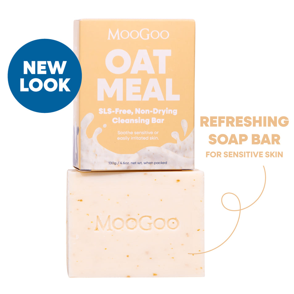 MooGoo Oat Meal SLS-free non-drying cleansing bar shown with its peach-colored packaging box and the actual bar below on a white background. refreshing soap bar for sensitive, dull skin, gentle and SLS-free. 