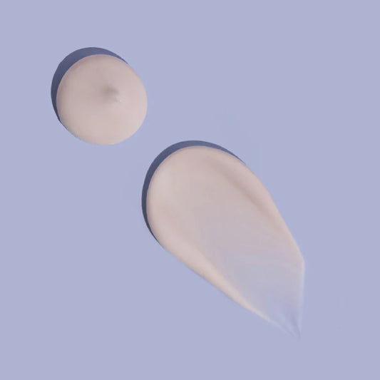 MooGoo Skin Milk Udder Cream texture on lilac background, lightweight moisturiser with aloe vera and vitamin E to hydrate dry, sensitive skin.