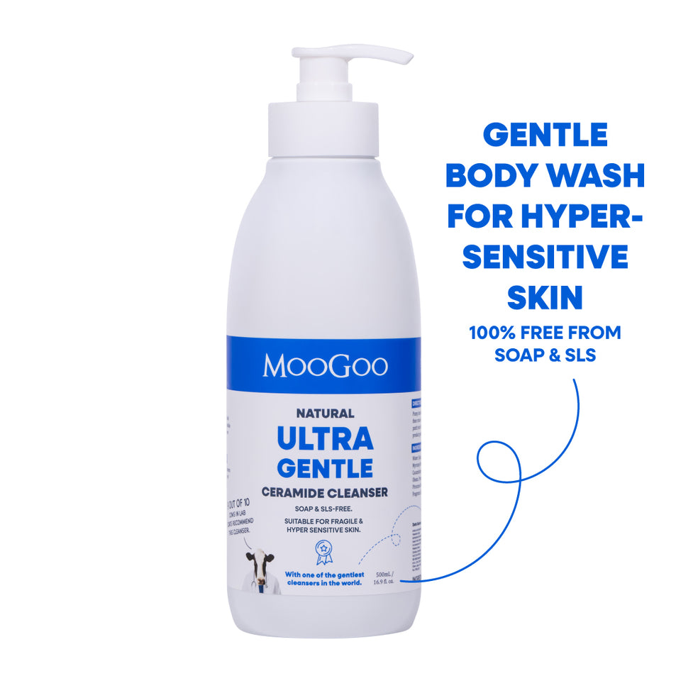 A white bottle of MooGoo Natural Ultra Gentle Ceramide Cleanser body wash with a pump dispenser, shown on a white background with blue promotional text on the right. For eczema prone and hypersensitive skin with ceramides to strengthen skin. 