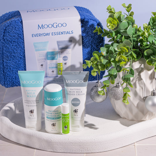 MooGoo natural skincare Everyday Essentials kit on display with cosmetic bag, aluminium free deodorant, hydrating cleanser, moisturiser and lip balm