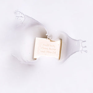 MooGoo Oatmeal Cleansing Bar splashing in milk, natural soap with cocoa butter and olive oil for hydration